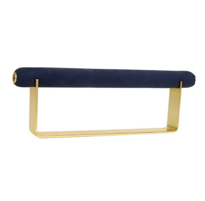 Velvet Ring DISPLAY stand in gold with a navy velvet bar, shown empty at an angle against a white background.