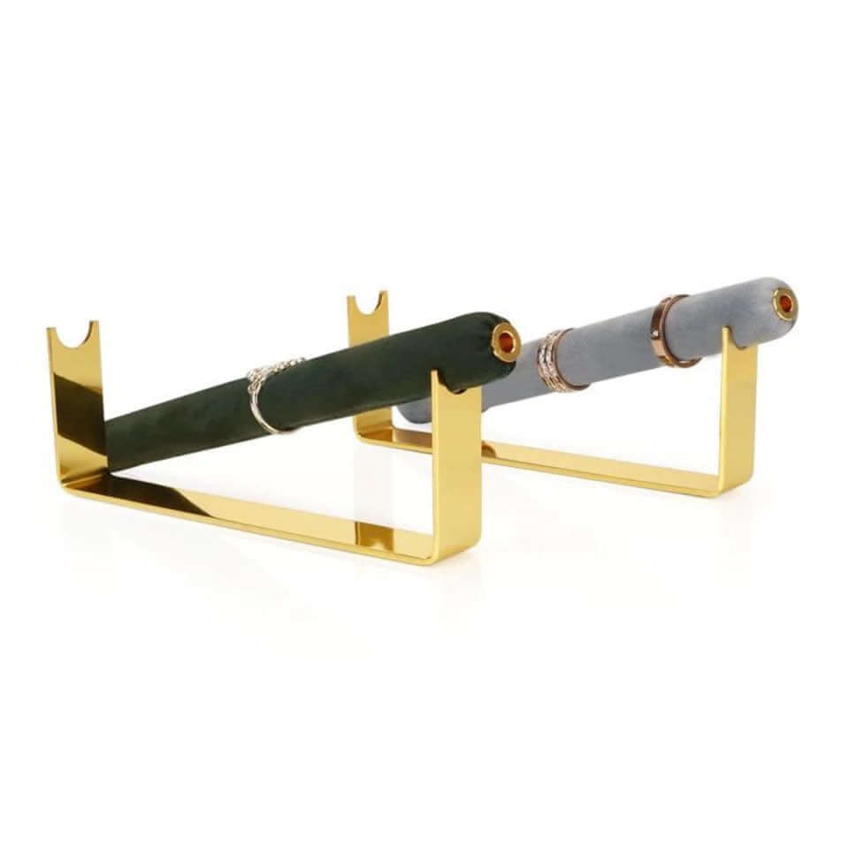 Velvet Ring DISPLAY stands in gold, a dark green bar with a thin silver ring and a grey bar with stacked gold band rings, angled together.
