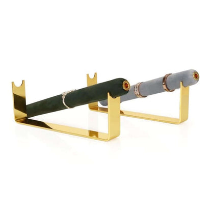 Velvet Ring DISPLAY stands in gold, a dark green bar with a thin silver ring and a grey bar with stacked gold band rings, angled together.